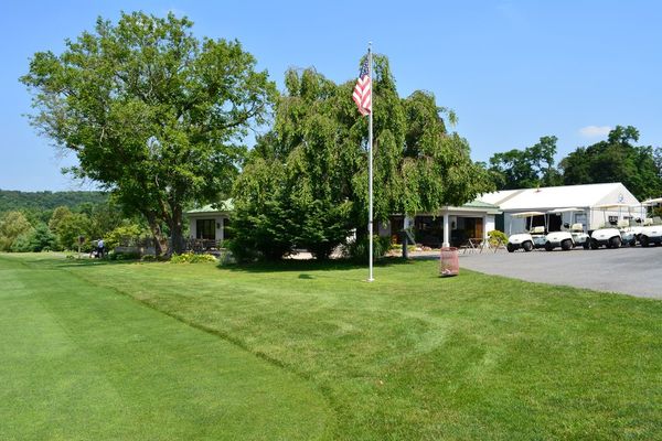 An American flag in front of the clubhouse at Chapel HIll